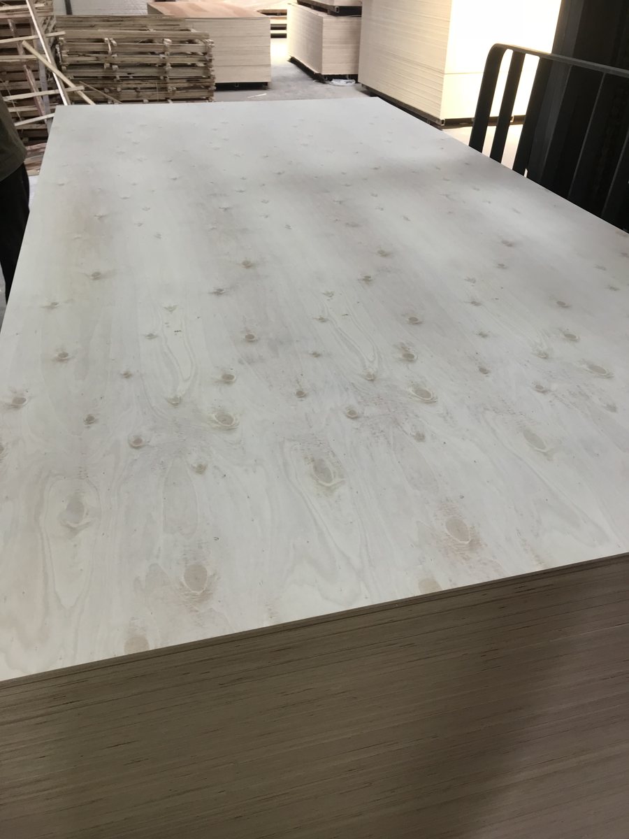 Wood-faced panel stack showing the surface and exposed sheet edges
