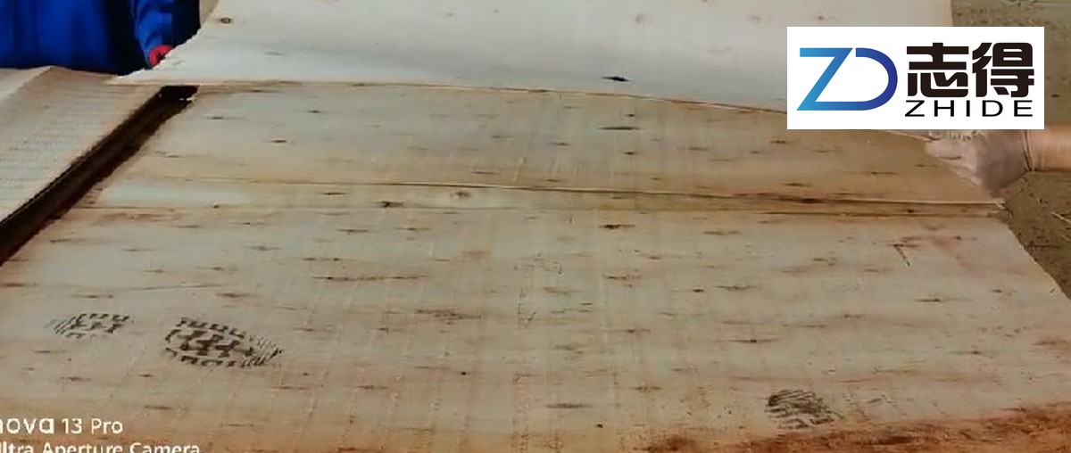 Historical close view of eucalyptus veneer sheet surfaces laid over a stack